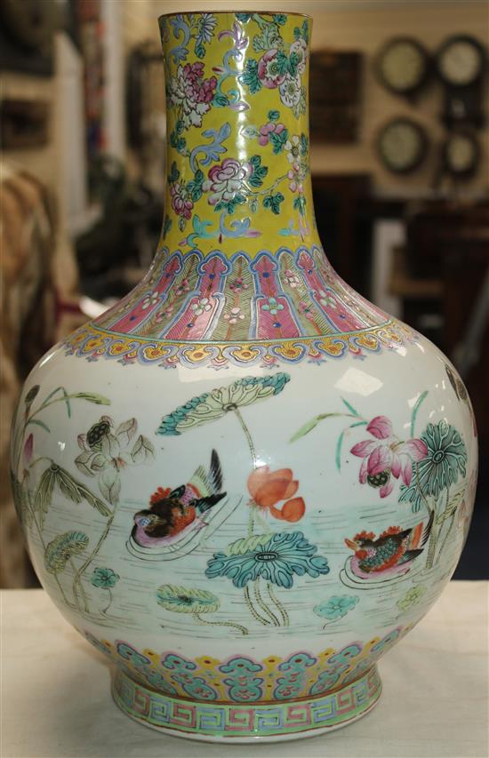 A Chinese famille rose bottle vase, Daoguang seal mark and of the period (1821-50), 36cm, neck reduced, base drilled